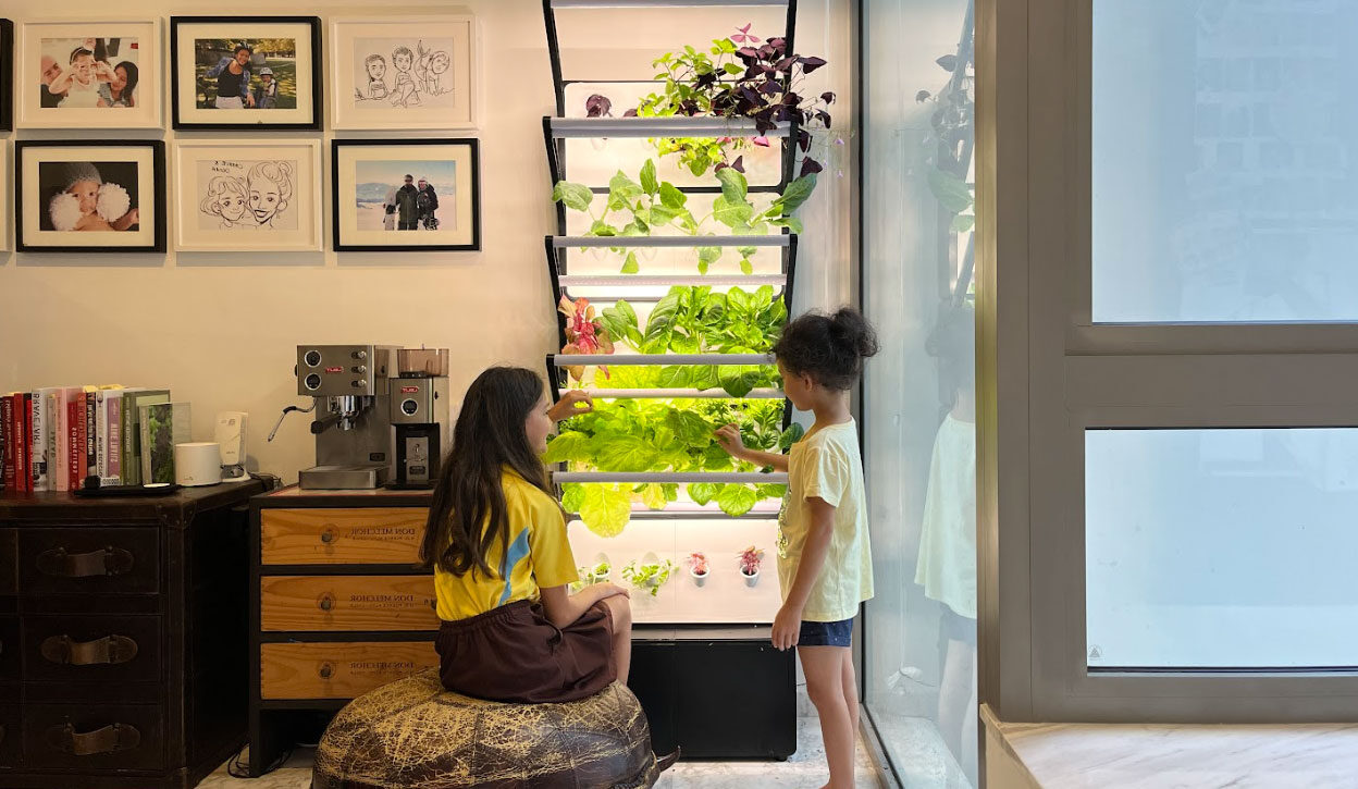 Kids interacting with the Grobrix for Home Vertical Garden